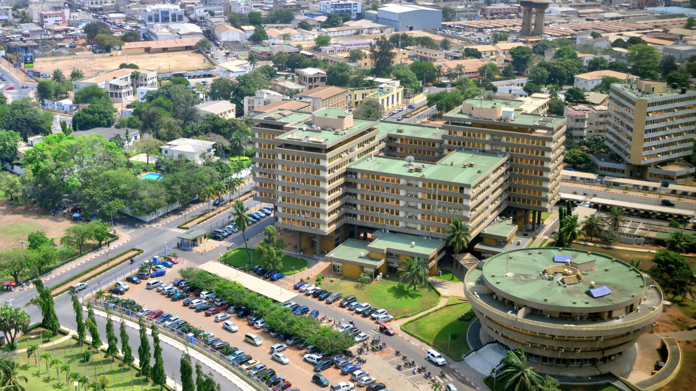 Aerial view of the Palais des Congrès de Lomé and the Togo city skyline, showcasing a prime location for business expansion through an employer of record in Togo.